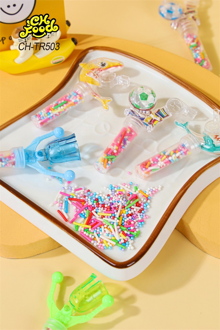 Low MOQ Small Plastic Dolphin and Football Whistle Shaking Needle Toys with Colorful Candy for Kids